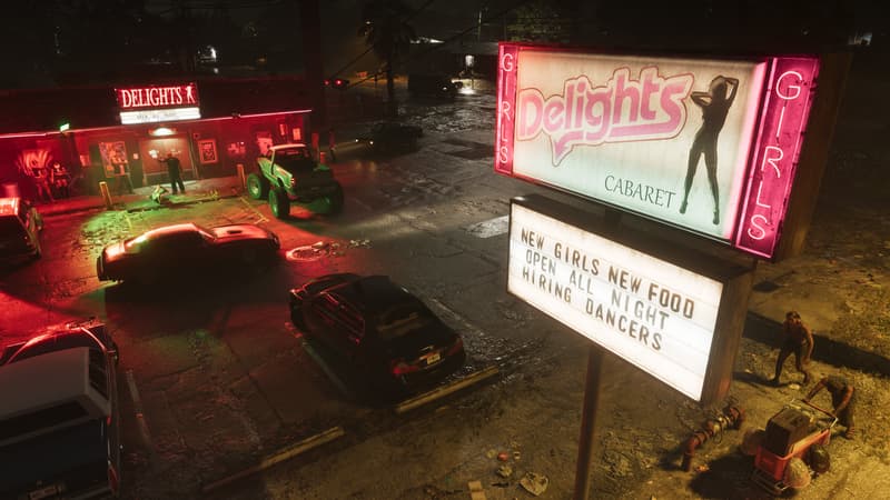 A pink neon Delights Cabaret sign and a letterboard reading New Girls, Open All Night over a wet parking lot.