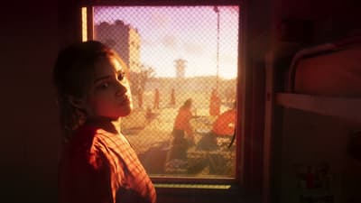 Lucia glances back over her shoulder in prison orange, sunlit yard behind her