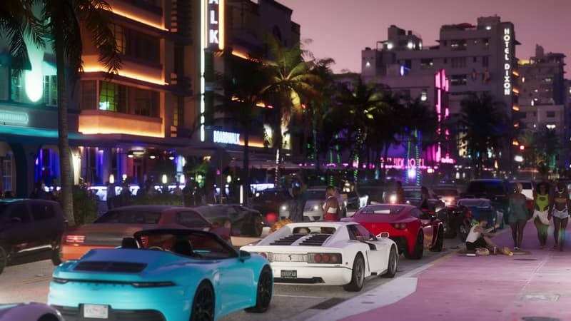 Neon-lit strip of art deco hotels with sports cars nosed in at the kerb
