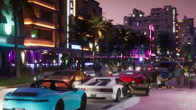 Supercars and evening crowds outside glowing hotel facades on a pink-lit boulevard