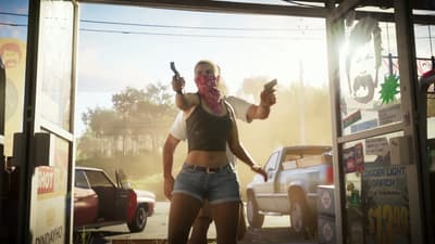 Lucia levelling two pistols inside the store, daylight blowing out the doorway behind