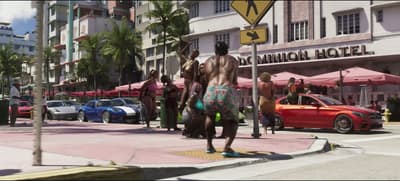 Ocean Drive outside the Dominion Hotel, supercars kerbside under pink awnings