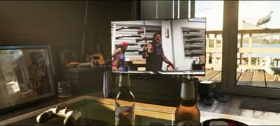 Phil’s Ammunation advert: a man hoists a rifle in front of wall racks of long guns