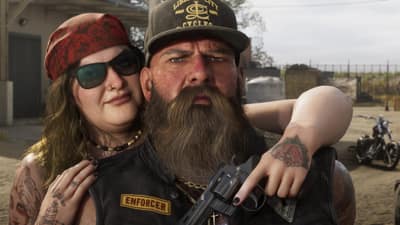 A bearded biker in an Enforcer vest and a woman holding a revolver pose in a club yard.