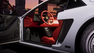 An open car door showing a red leather cabin and red steering wheel, city towers at dusk.