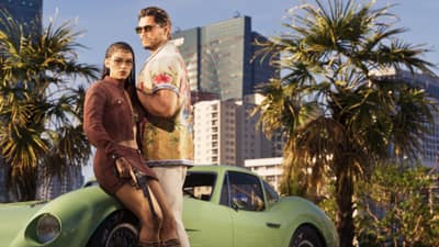 A woman holding a revolver sits on a green sports car beside a man in a floral shirt.