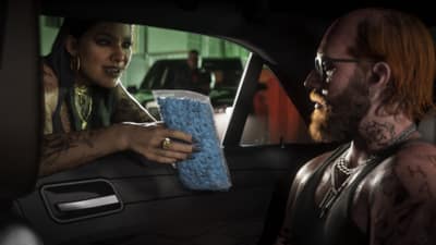 A tattooed woman passes a bag of blue pills through a car window to a bearded driver.