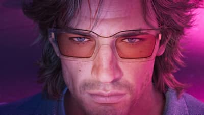 Close portrait of a man in rose-tinted rectangular glasses against a magenta wall.
