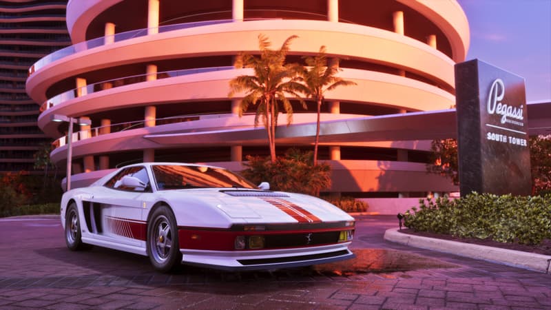 A white and red wedge-shaped sports car with side strakes parked outside a lit apartment block at dusk.
