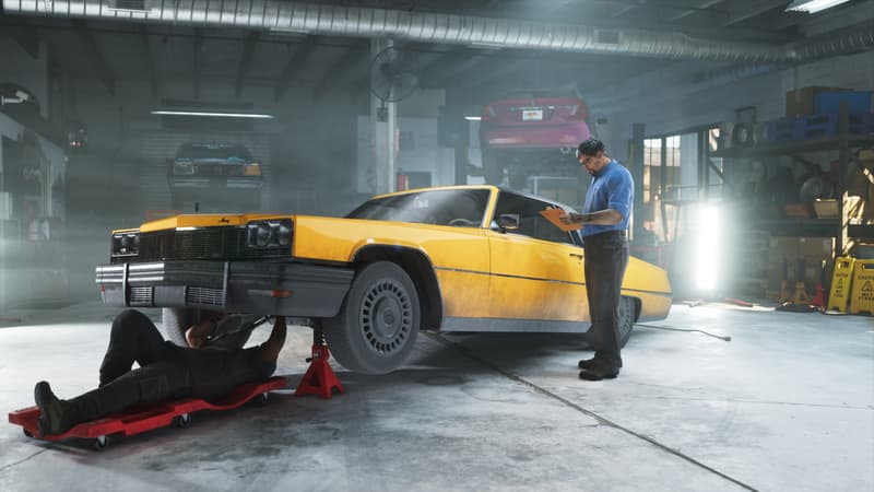 A yellow coupe sits on jack stands in a workshop; one mechanic works underneath, another checks a clipboard.