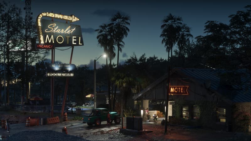 A tall lit sign reading Starlet Motel, Vacancy, Pool and Wifi glows over a low roadside motel at dusk.